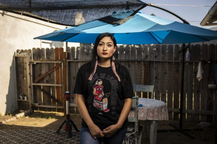 Melissa Alcala, a member of the Navajo Nation, in her back yard in Eastern Los Angeles. Alcala's son, Gavin, is attending online school and receiving therapies after several months hiatus due to the pandemic. Martin do Nascimento / Resolve Magazine
