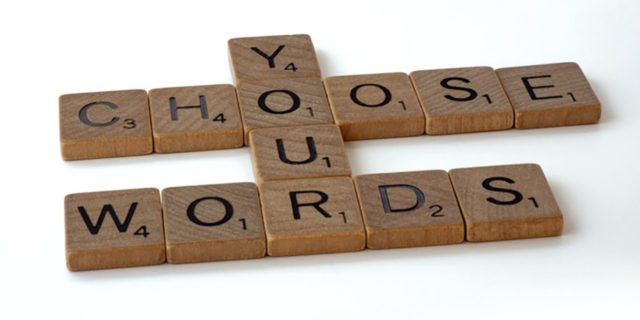 Scrabble letters spelling "Choose your words."