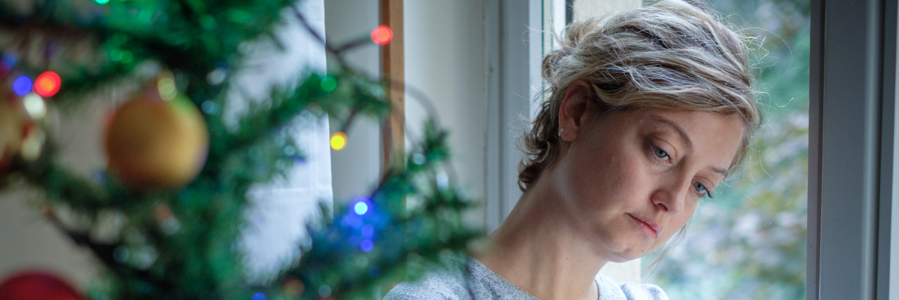 Adjusting to the Upcoming Pandemic Holiday Season Woman feeling alone during christmas holiday