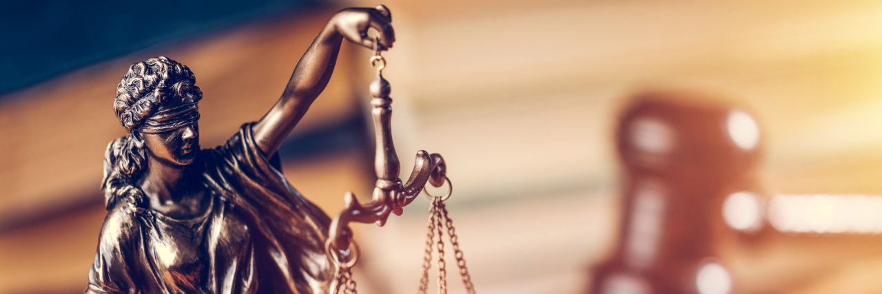 Alek Minassian's Defense Is False and Hurts the Autism Community Law and justice concept - Themis statue, judge hammer and books.