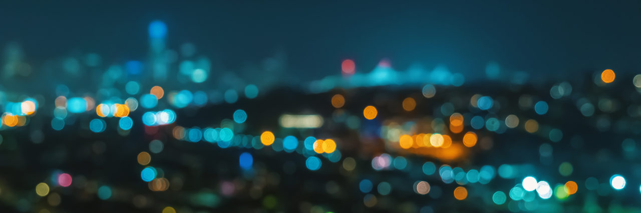Life as an Adult With Sensory Processing Disorder Blurred abstract bokeh background of San Francisco city lights.