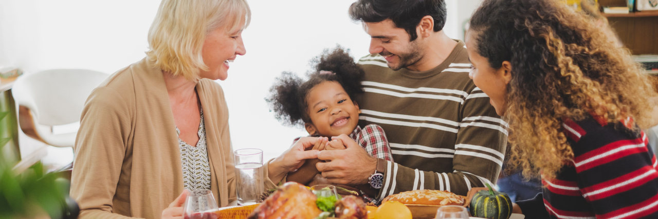 An Inflammatory Bowel Disease Guide to Thanksgiving Survival Thanksgiving dinner with family and food with turkey on table