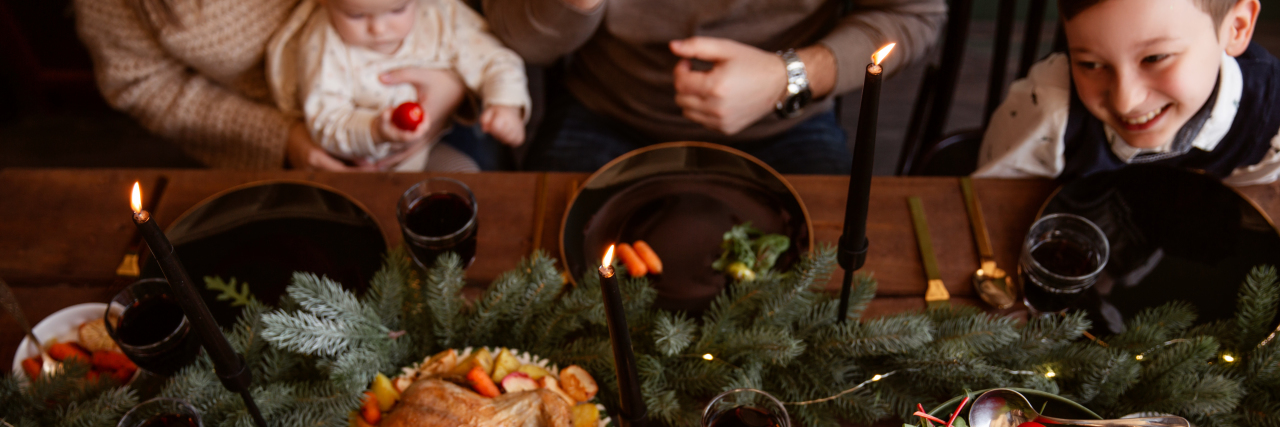 6 Ways to Rethink the Holidays for Your Child on the Autism Spectrum Family gathering for Christmas dinner.