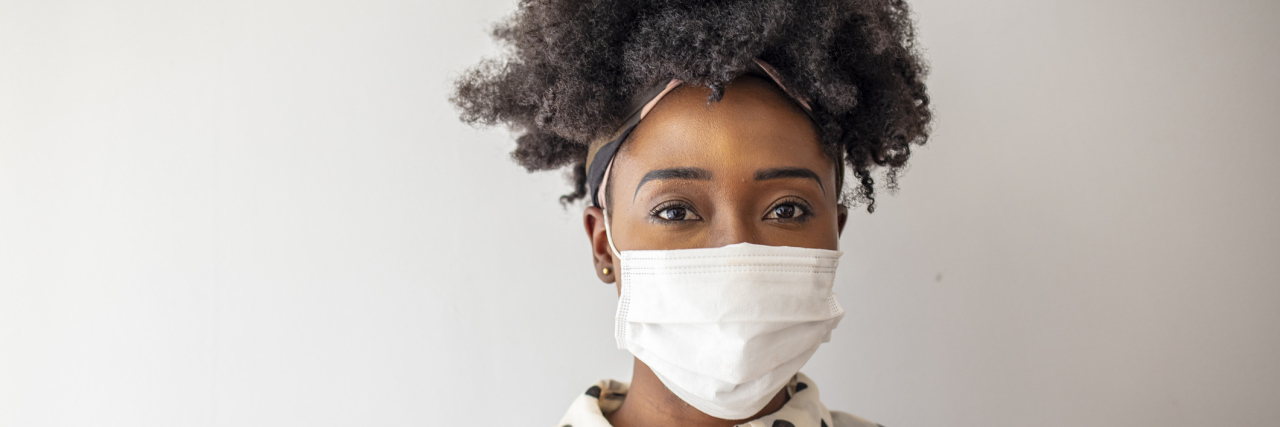 Doctors Aren't Taught How to Spot Racism in Health Care woman wearing mask for protect. Woman wear with protective face mask at home.