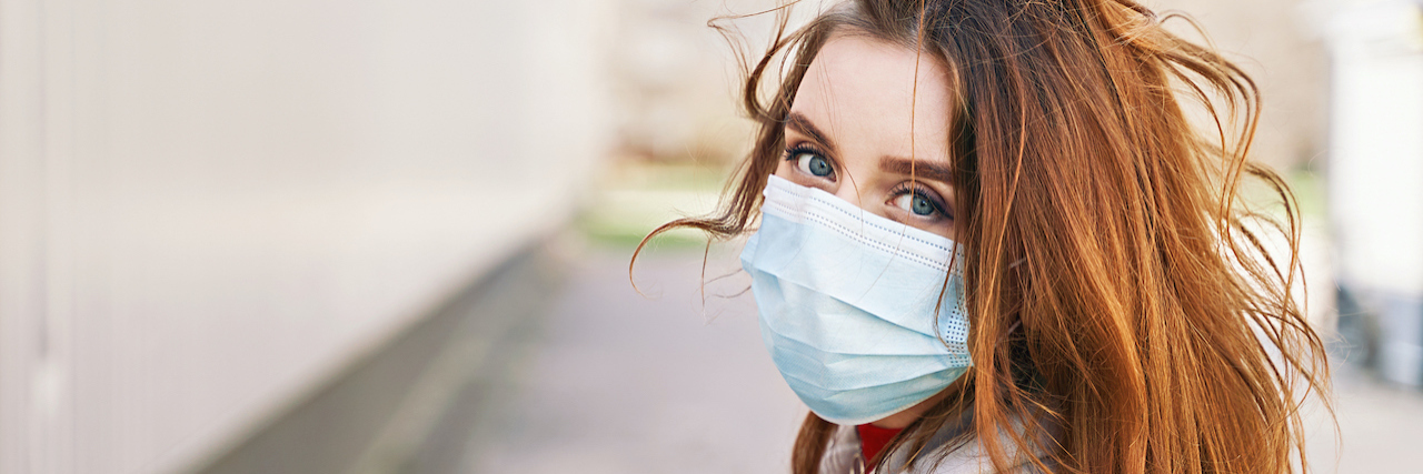 Letter to People With Health Privilege During the COVID-19 Pandemic A woman wearing a mask