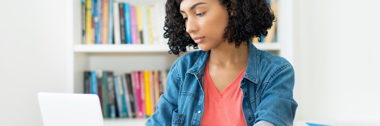 College Preparations for High School Students During COVID-19 Student working at computer in quarantine.