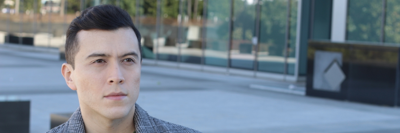 I'm Getting Tired of Talking About My Disability Young man walking on the street.