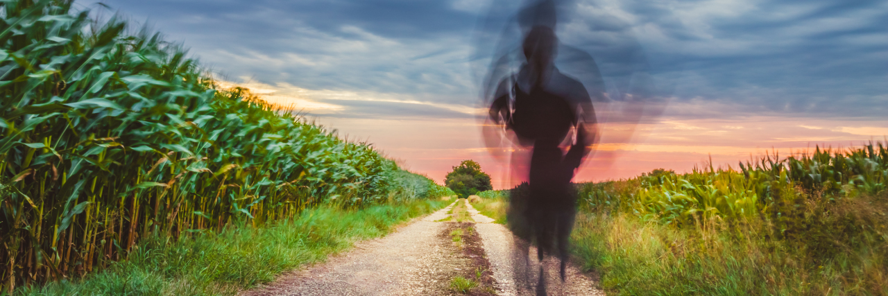 On Letting Go of the Perfect Version of Myself a person jogging on a rural road