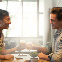 Two men on a date at a restaurant.