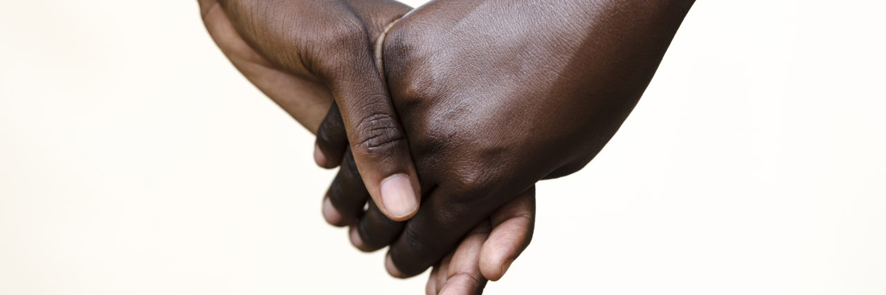 How to Take Care of Someone When You're Both Chronically Ill holding hands