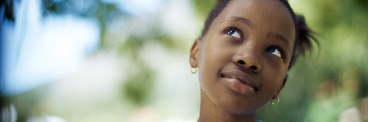 Dear Parents: Please Let Your Kids Ask About My Disability Curious girl looking upward.