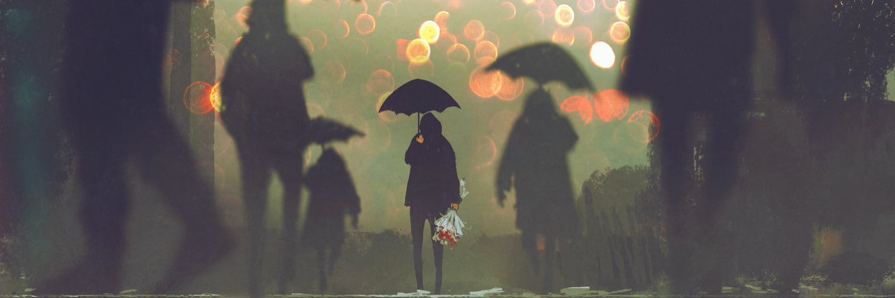 a crowd holding umbrellas