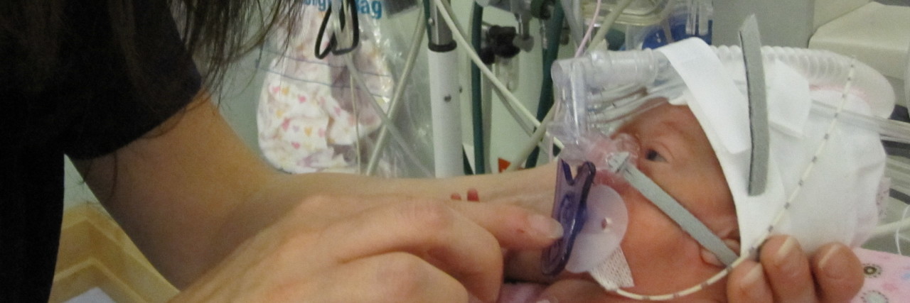 How Caregivers Wearing COVID-19 Masks Affects NICU Babies Premature baby in the NICU.
