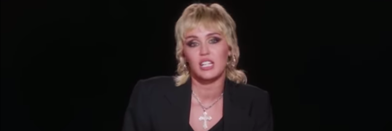 Miley Cyrus Shares How She Processes Trauma and Loss Miley Cyrus wearing a black blazer