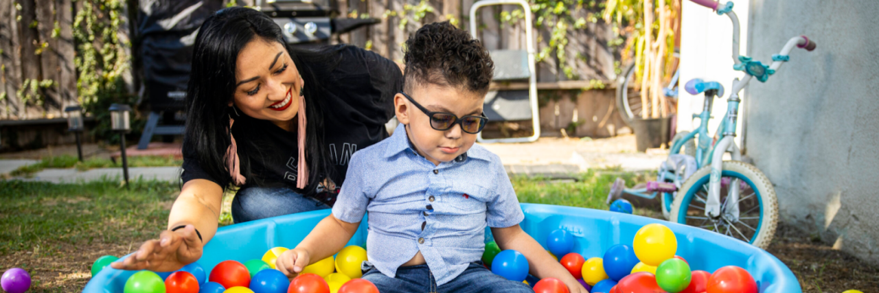 Melissa Alcala and her three-year-old son Gavin play in the ball pit behind their home in Eastern Los Angeles[Martin do Nascimento / Resolve Magazine