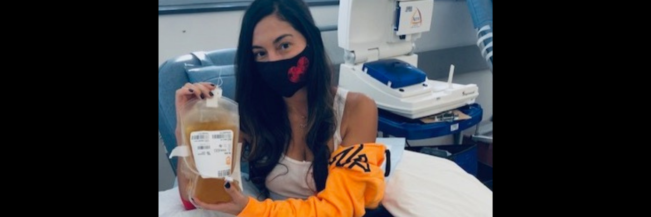 A COVID-19 Recovery Story From a Medical Mama a woman holding a bag of donated plasma