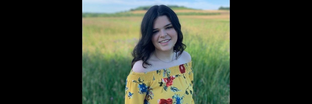 Though Conventional Medicine Helps Many, It Couldn't Help Me A young woman standing in a field smiling