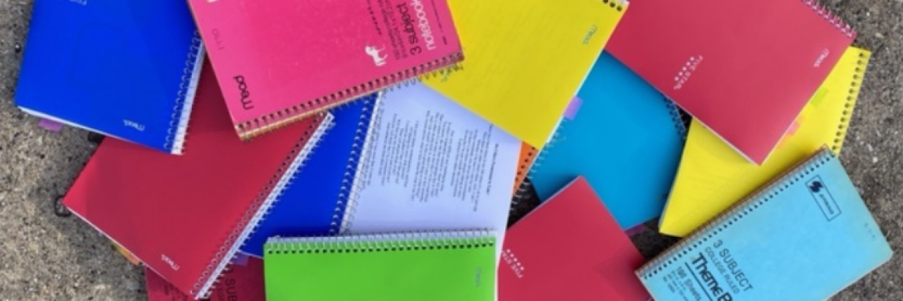 Do I Have Permission to Tell My Mental Health Story? A stack of journals