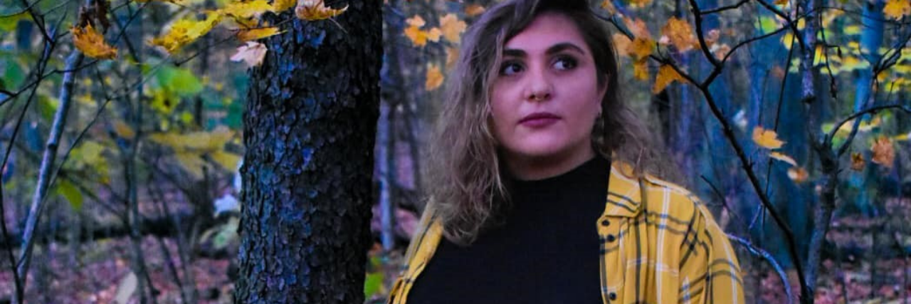 I Wish People Recognized How Much Mental Illness Affects Relationships photo of contributor, a woman standing in autumnal woods looking off camera