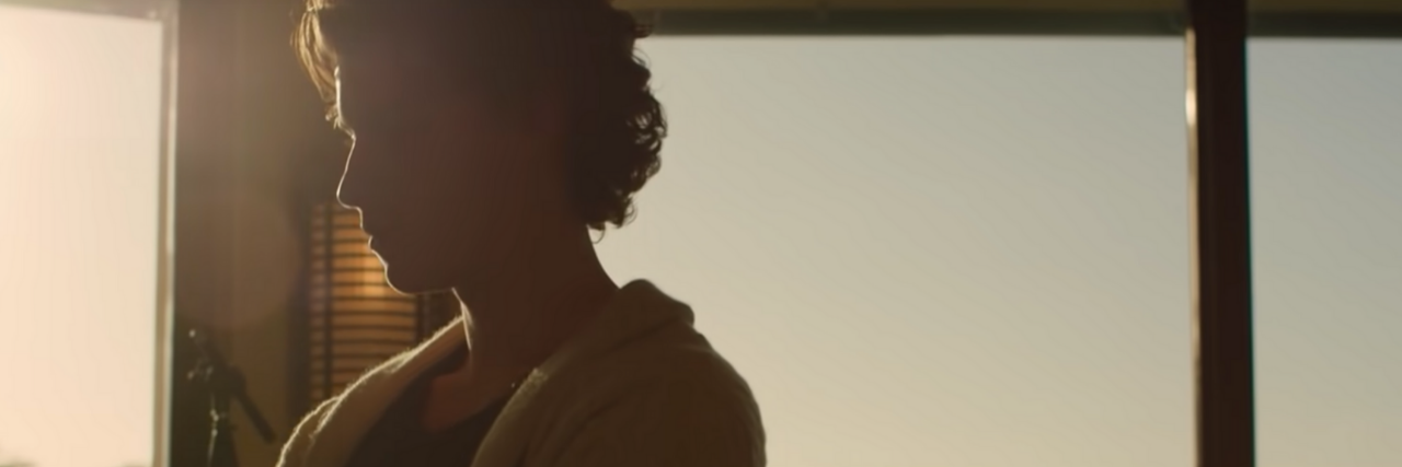 Watching the Netflix Shawn Mendes Documentary With a Mental Illness screenshot of shawn mendes documentary from Netflix, showing the musician silhouetted by a window at sunset