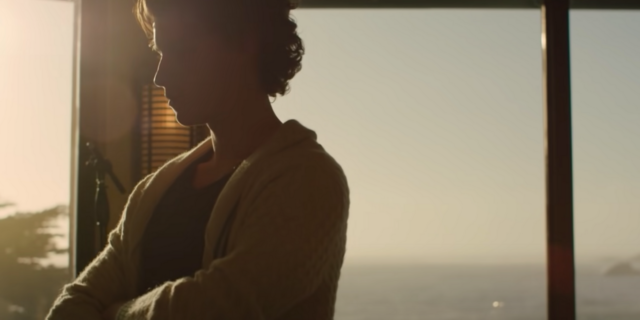 screenshot of shawn mendes documentary from Netflix, showing the musician silhouetted by a window at sunset