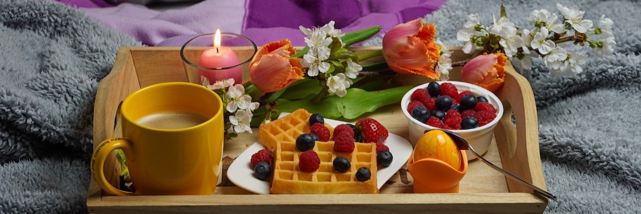 Photo of lavish breakfast in bed tray