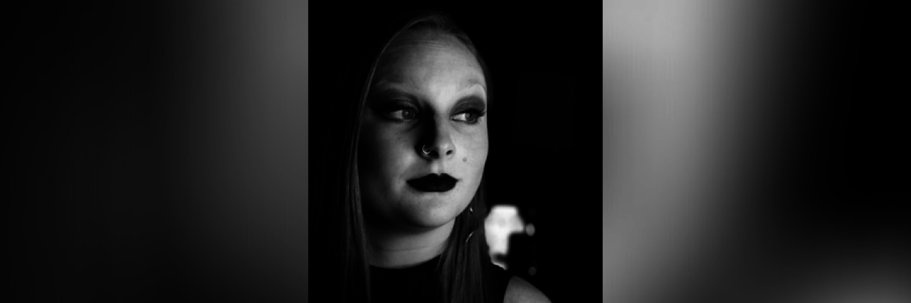 Celebrating Sexuality as Someone With Chronic Illness Black and white image of contributor looking to side of camera