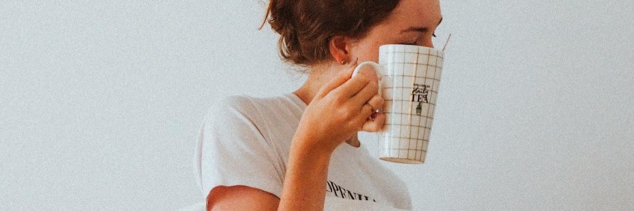 How Anxiety, Depression and Grief Affect Sleep A woman holding a pillow and a mug