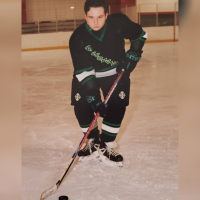 Mikey playing hockey.