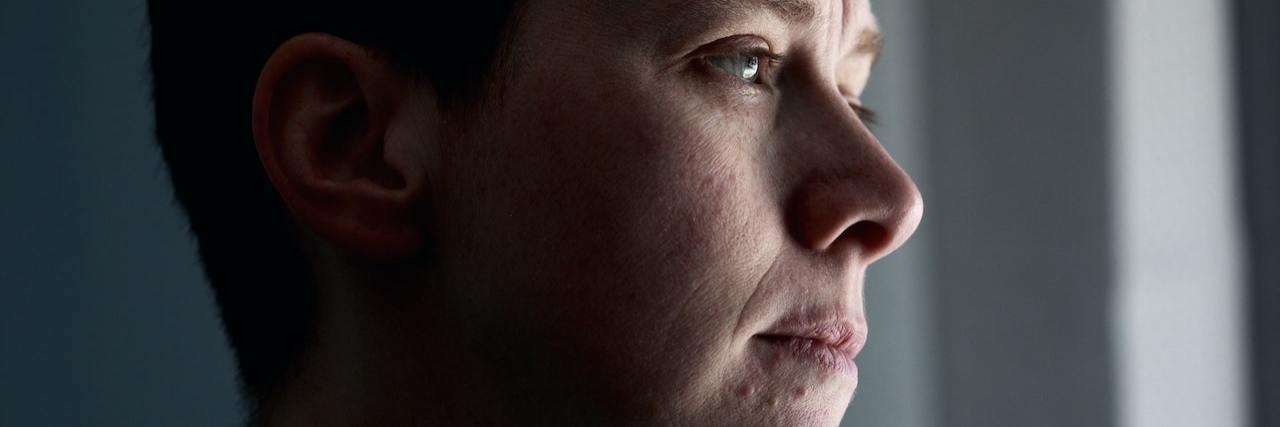 How Experiencing Trauma Leads to Addiction A person looking out a window