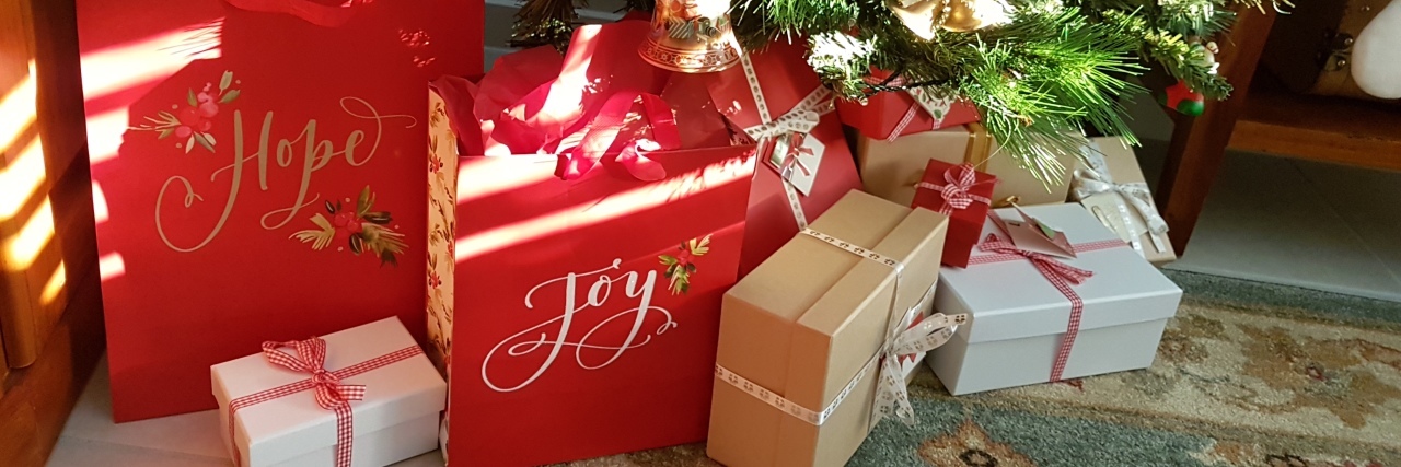 Presents under Christmas tree.