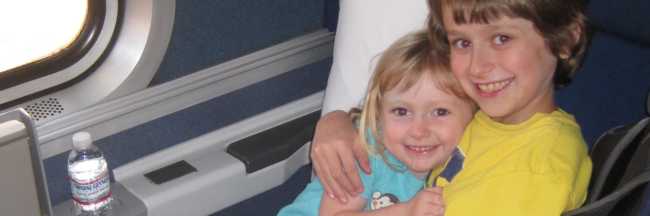 My Autistic Son's Love for His Sister Is Different, Never Less Ryan with his sister on a train when they were young children.