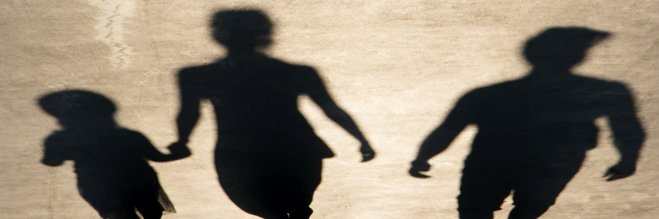 Stereotypes Make It Hard to Talk About Abusive Mothers Blurry shadow of parents and daughter