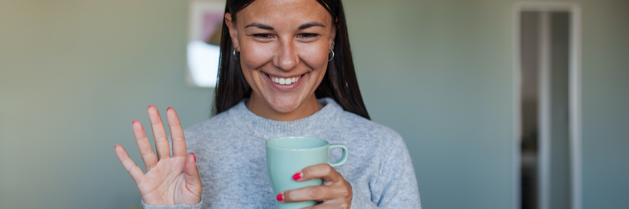 COVID-19 Shows Accommodations for Disabled Workers Are Possible A woman waving at her computer
