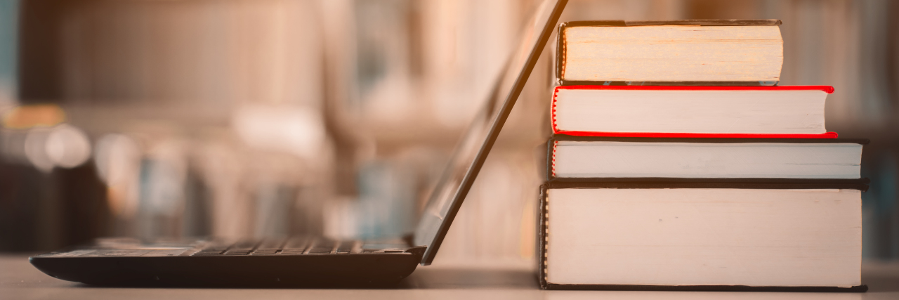 Books, Support Groups and Other Resources for Stroke Survivors Books and laptop computer on table.