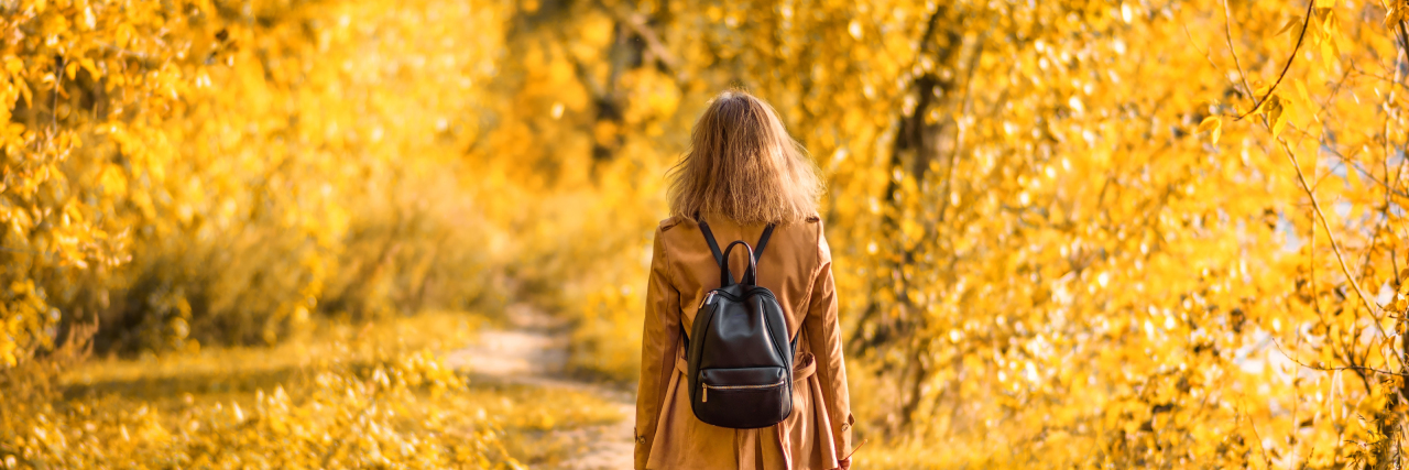 When I Feel Like I'm Not Where I'm Supposed to Be Because of My Health Woman in autumn park.