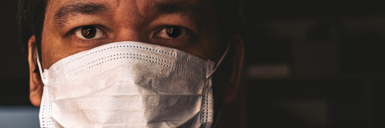 How Individual Selfishness is Strengthening COVID-19 man wearing a mask during COVID-19