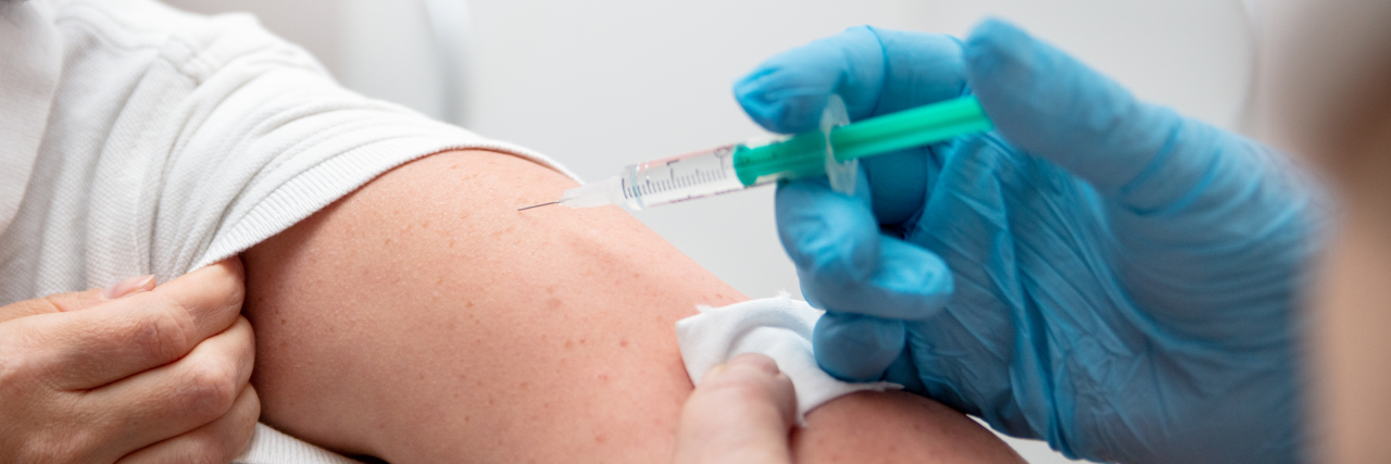 Nurse administering a covid-19 vaccine
