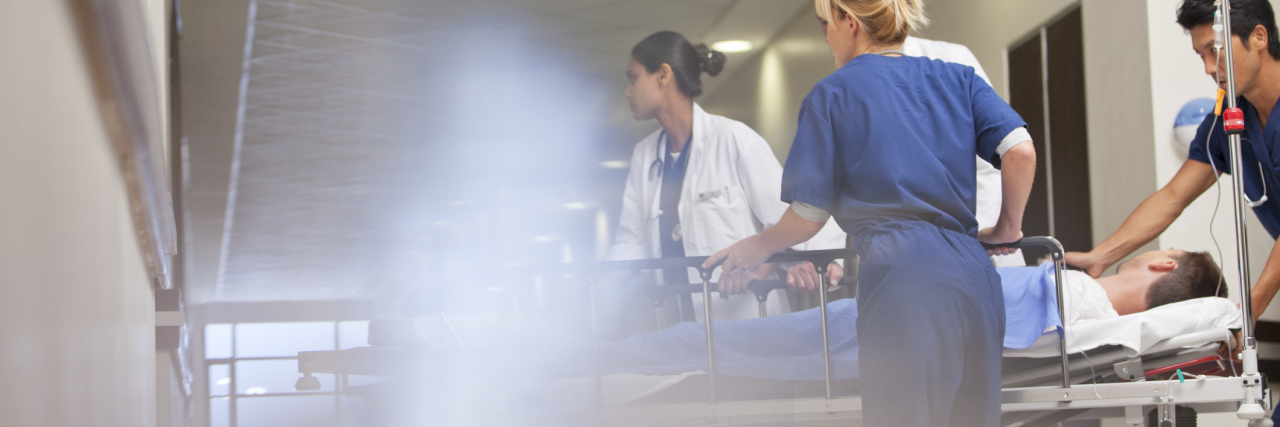 What Happened When the Only ER Doctor in a Rural Town Got COVID Doctors and nurses wheeling patient into hospital