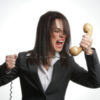 a woman is yelling into a phone