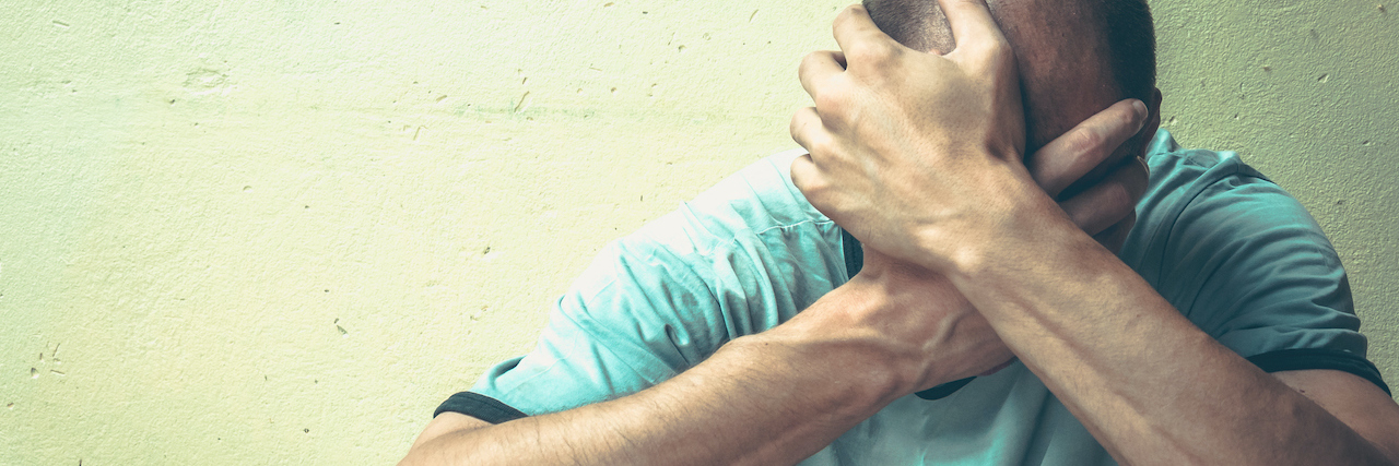 Why the War on Drugs Failed and What We Should Do Instead A man sitting against a wall, his head in his hands