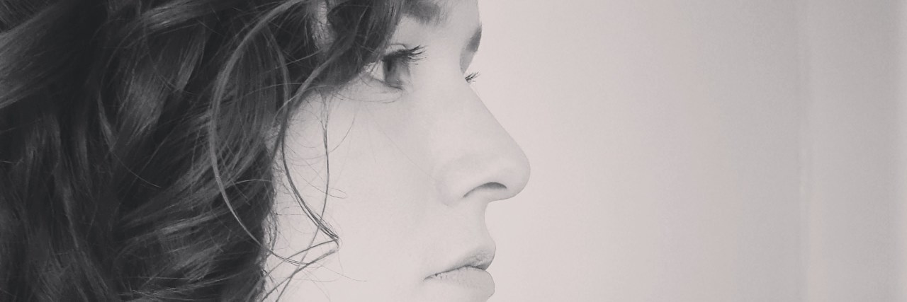 Being Autistic Doesn't Make Me a Bad Parent Black-and-white photo of Danielle in profile.