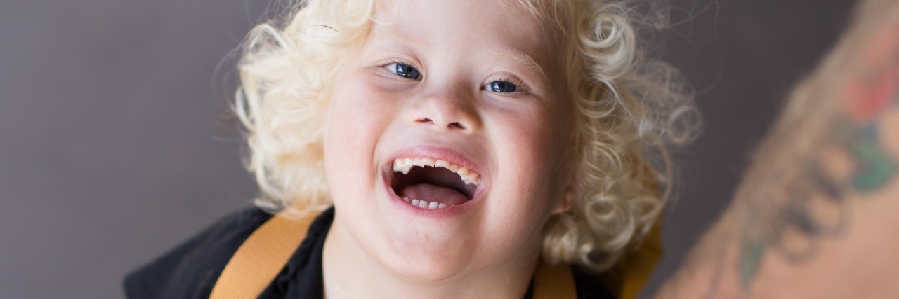 Celebrating the 'Inchstones' for My Son With Down Syndrome Eli looking up and smiling.