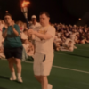 Michael Cusack carrying a torch at a special olympics event
