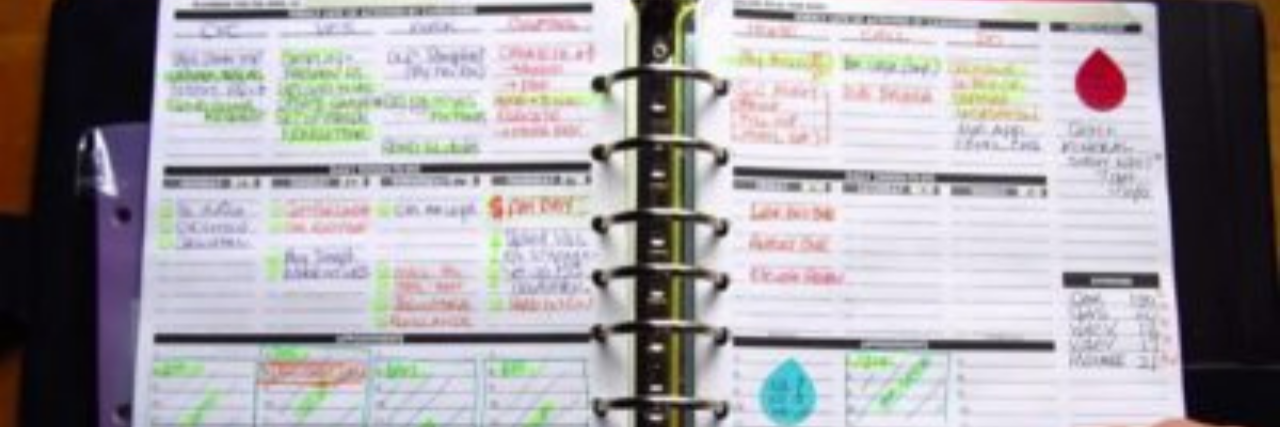 My OCD Makes It Hard to Clean and Plan Without Obsessing photo of author's planner, highlighted and filled with notes