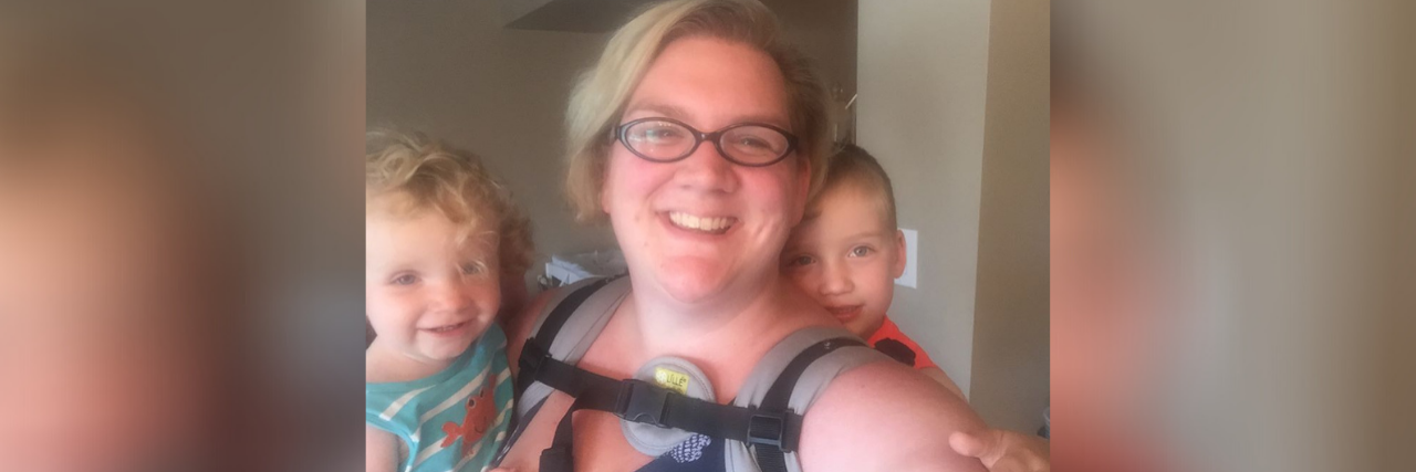 Image of contributor holding both of her children