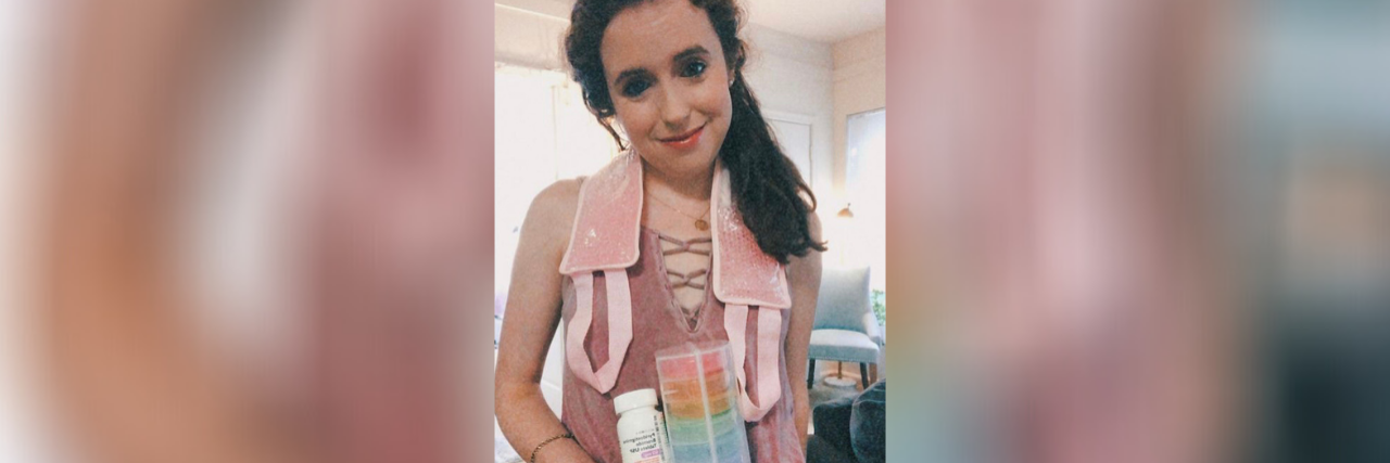 This Is Why You Don't Want a Post-Viral Syndrome Image of contributor holding up bottle of medicine