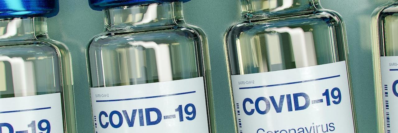 Line of COVID-19 vaccine bottles