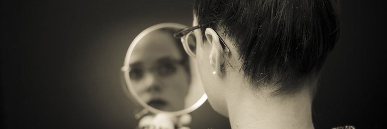 I Am What Ehlers-Danlos Syndrome Looks Like Woman looking in mirror.