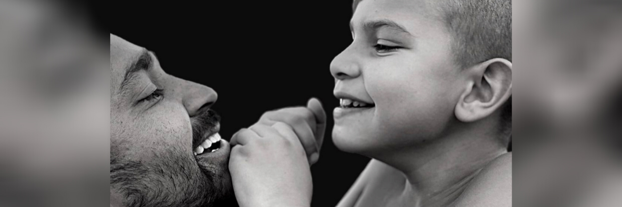 3 Things Not to Say to the Parent of a Child With a Disability Black and white photo of happy father and son.